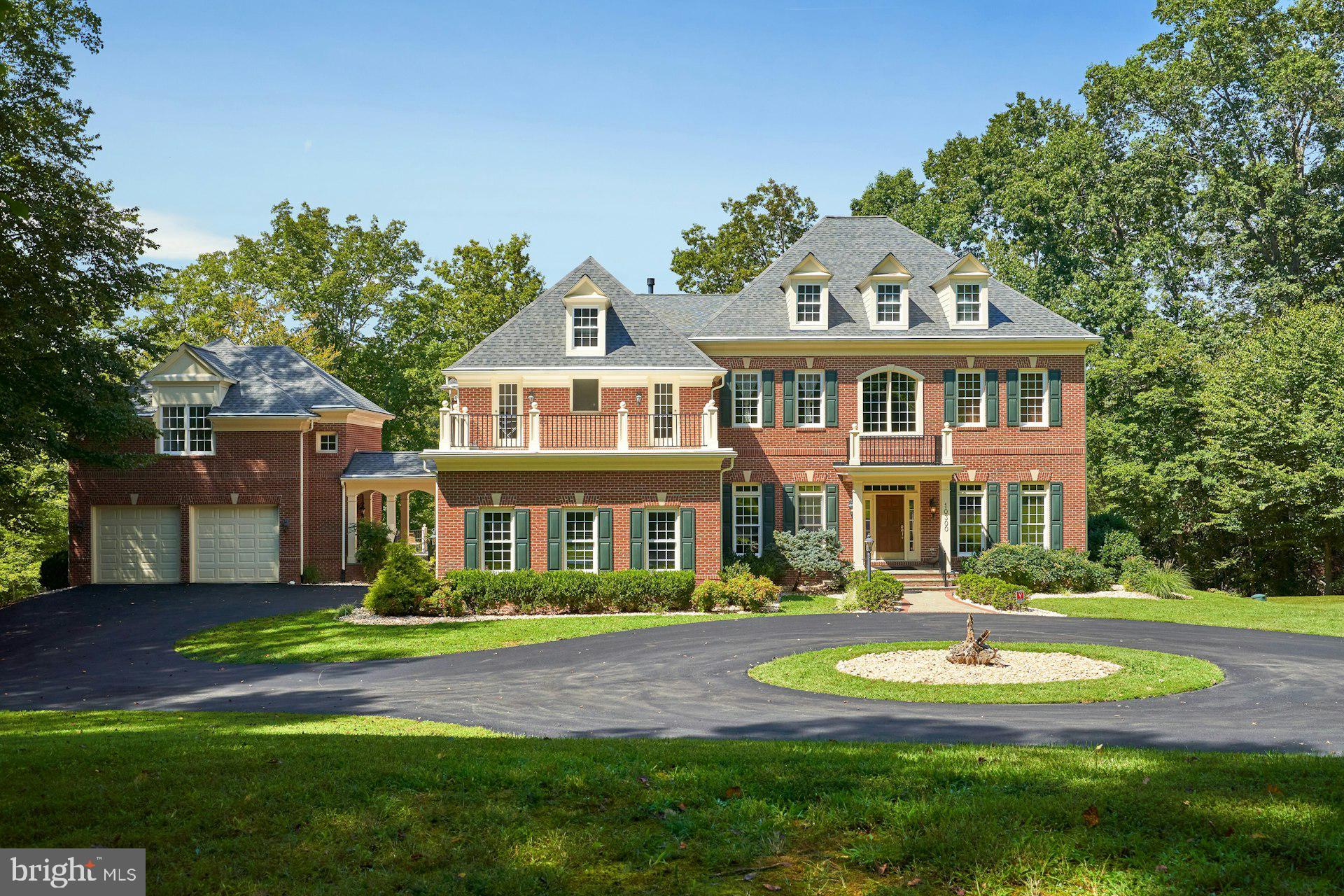 10300 Hampton Road Fairfax Station, VA 22039 - Photo 7 of 89 a front view of a house with yard and green space