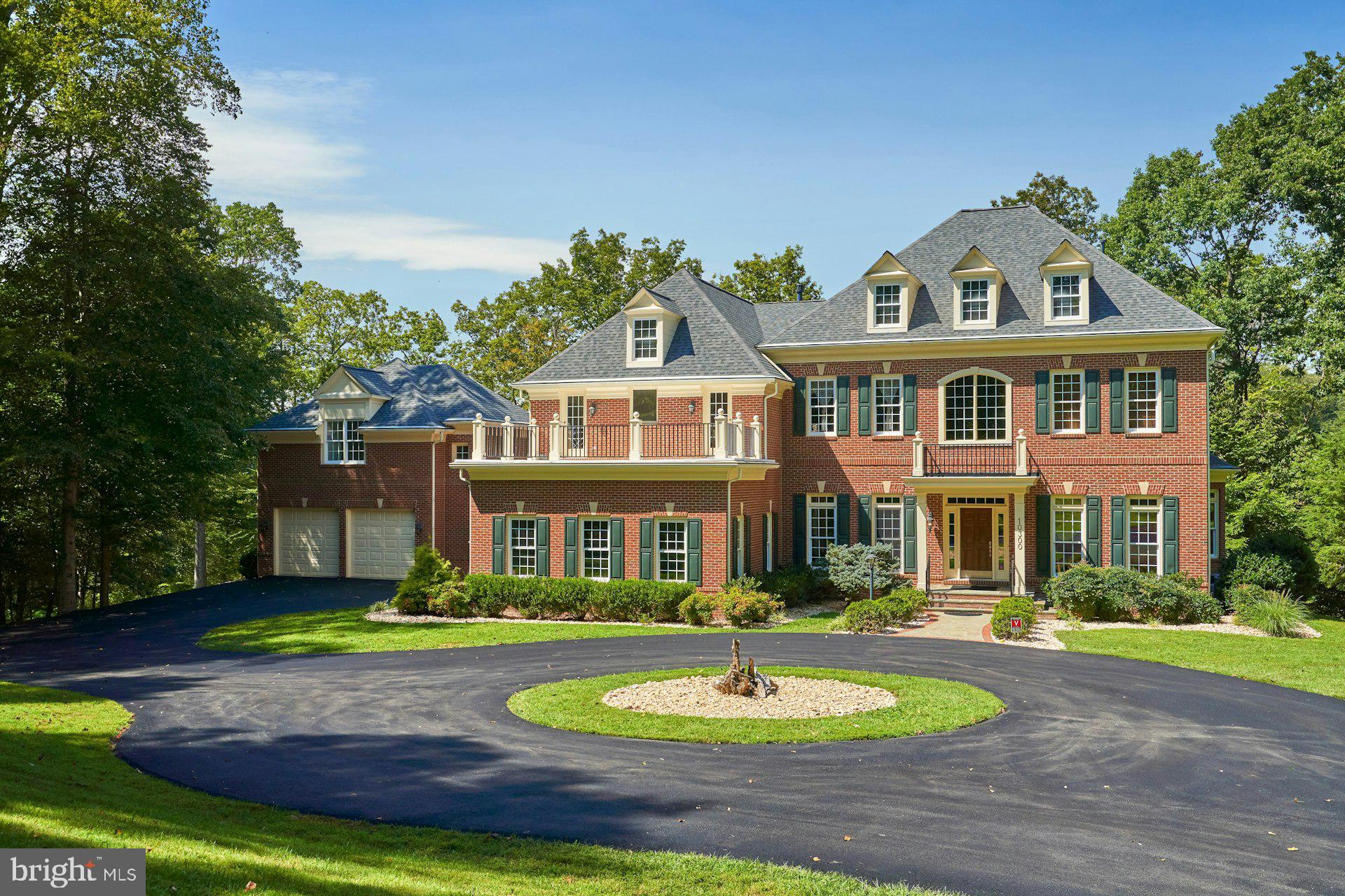 10300 Hampton Road Fairfax Station, VA 22039 - Photo 85 of 89 a front view of a house with a yard and trees