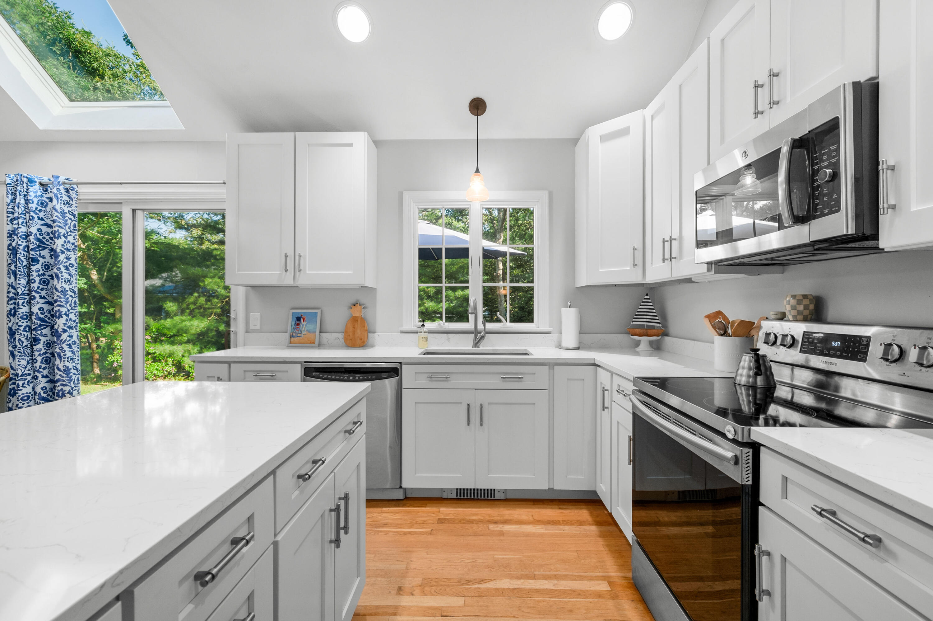 11 Quanset Road Orleans, MA 02653 - Photo 14 of 36 a kitchen with a sink stove and microwave