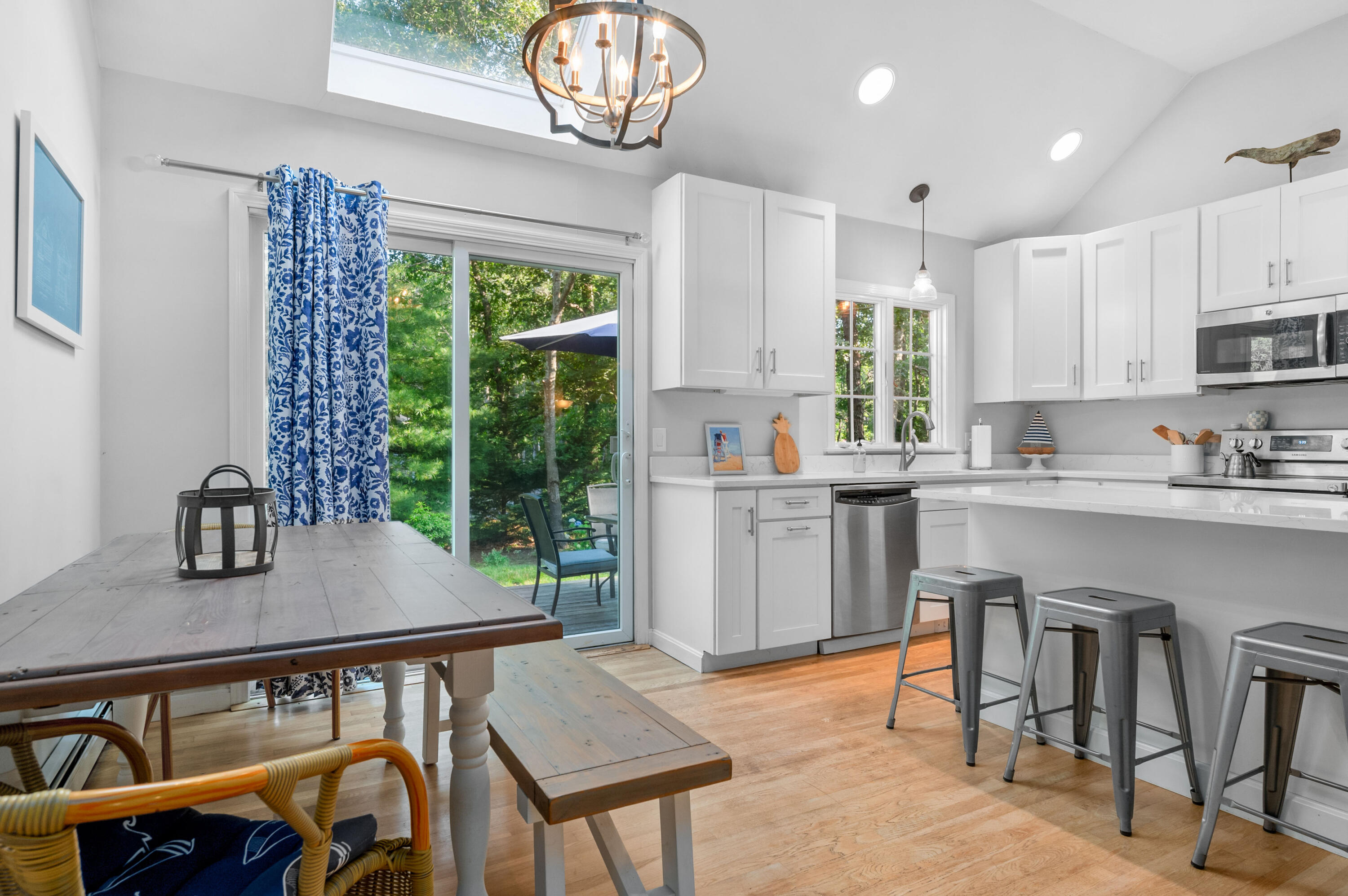 11 Quanset Road Orleans, MA 02653 - Photo 15 of 36 a kitchen with a table chairs sink and cabinets