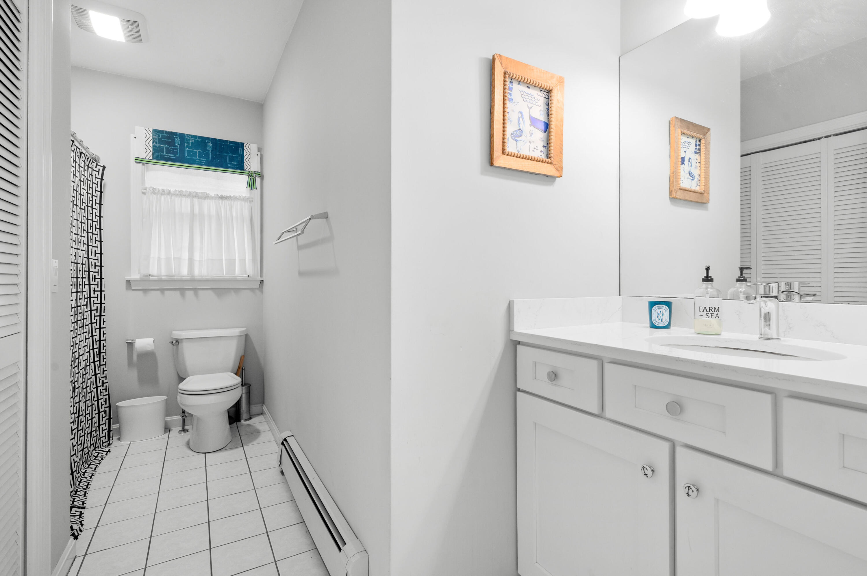 11 Quanset Road Orleans, MA 02653 - Photo 17 of 36 a bathroom with a sink mirror and a toilet