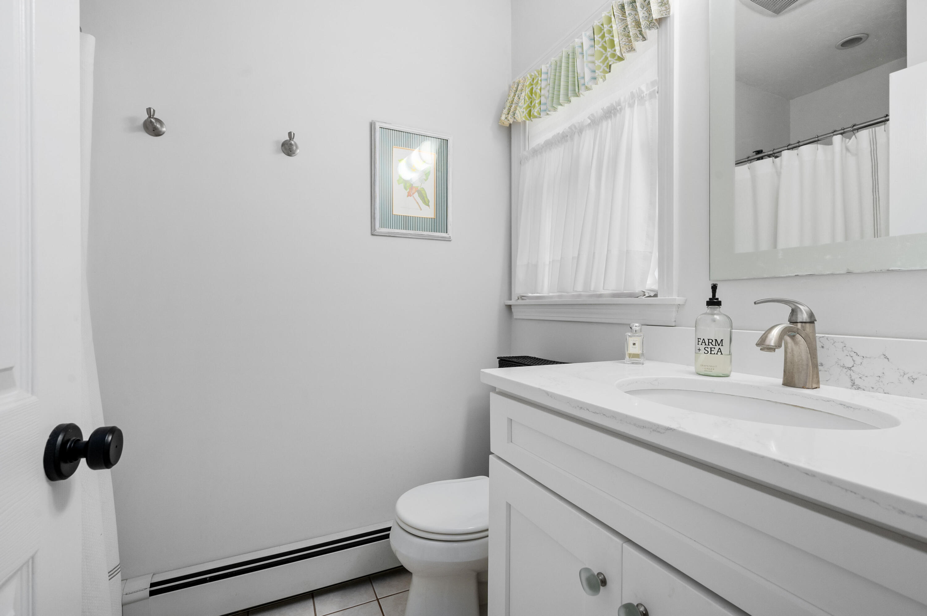 11 Quanset Road Orleans, MA 02653 - Photo 21 of 36 a bathroom with a sink toilet and vanity