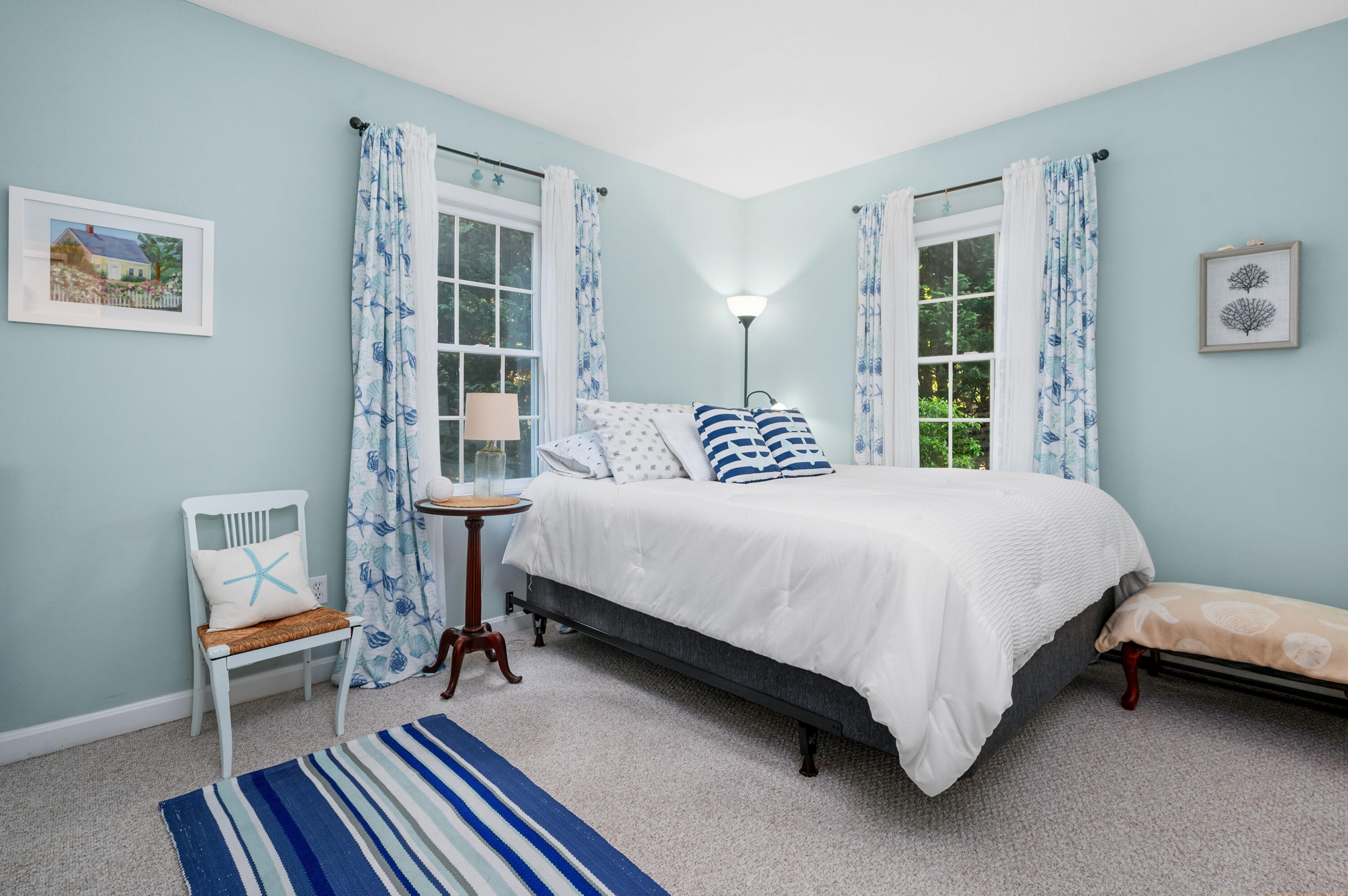 11 Quanset Road Orleans, MA 02653 - Photo 22 of 36 a bedroom with a bed a table and chair