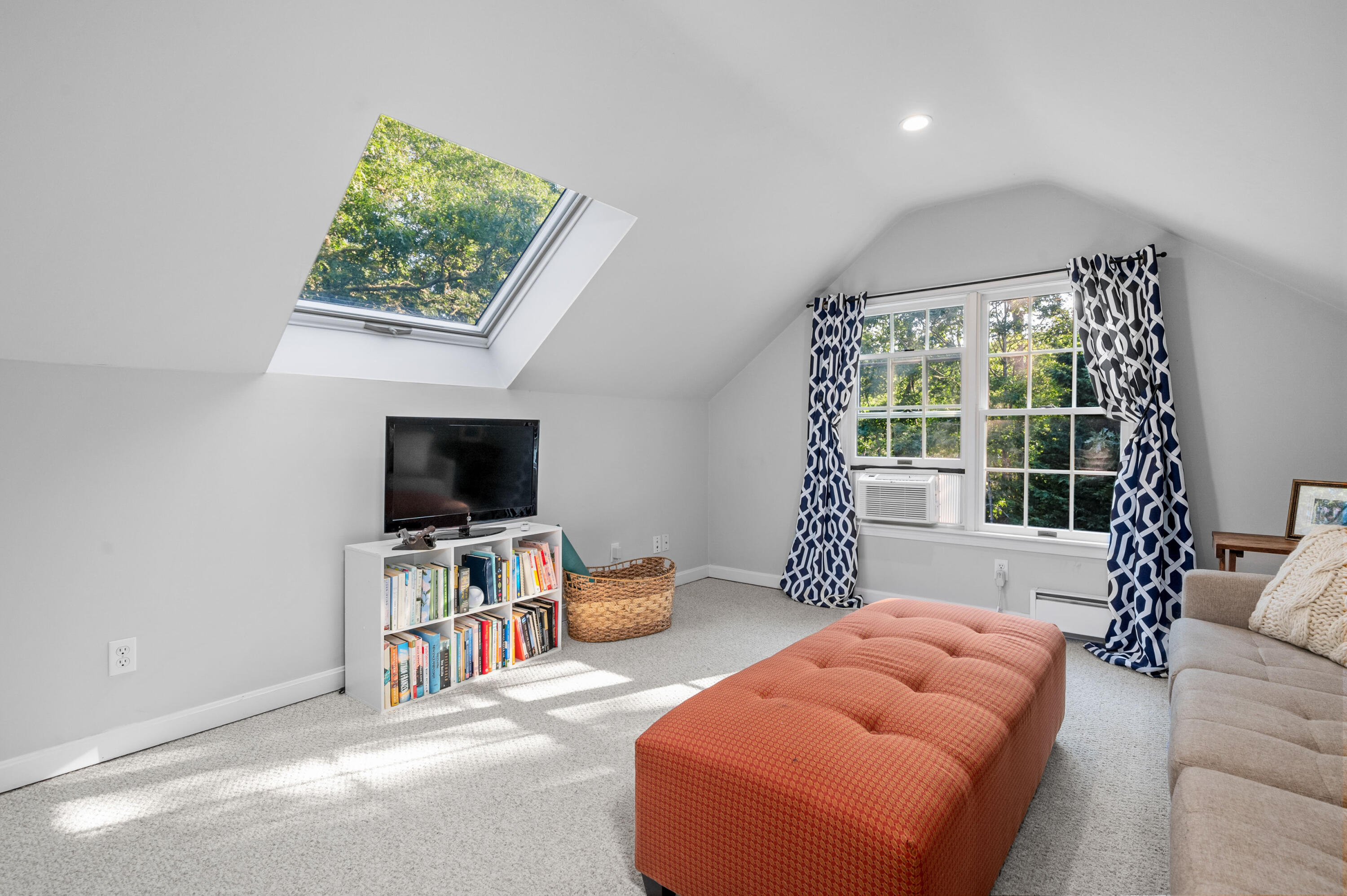 11 Quanset Road Orleans, MA 02653 - Photo 26 of 36 a bedroom with furniture and a flat screen tv