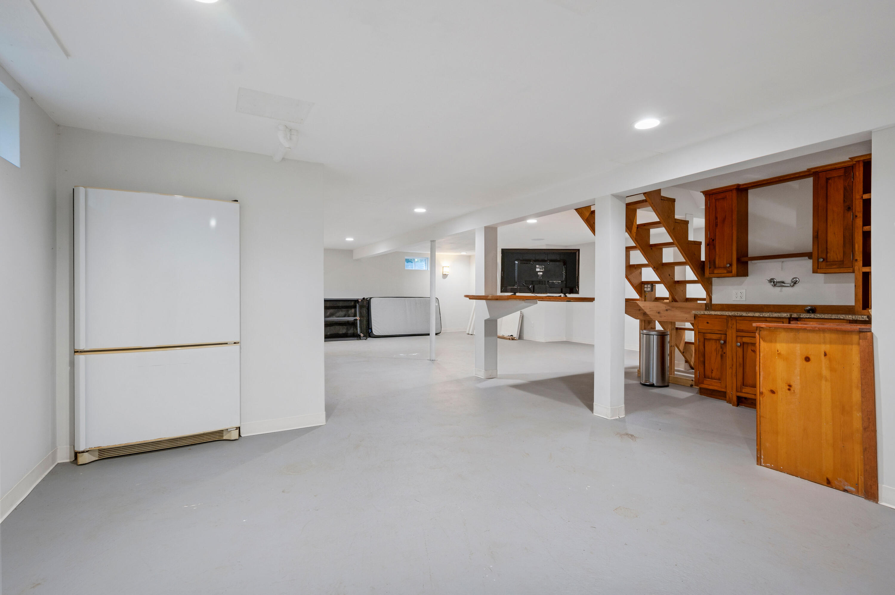 11 Quanset Road Orleans, MA 02653 - Photo 28 of 36 a view of living room kitchen with furniture and flat screen tv