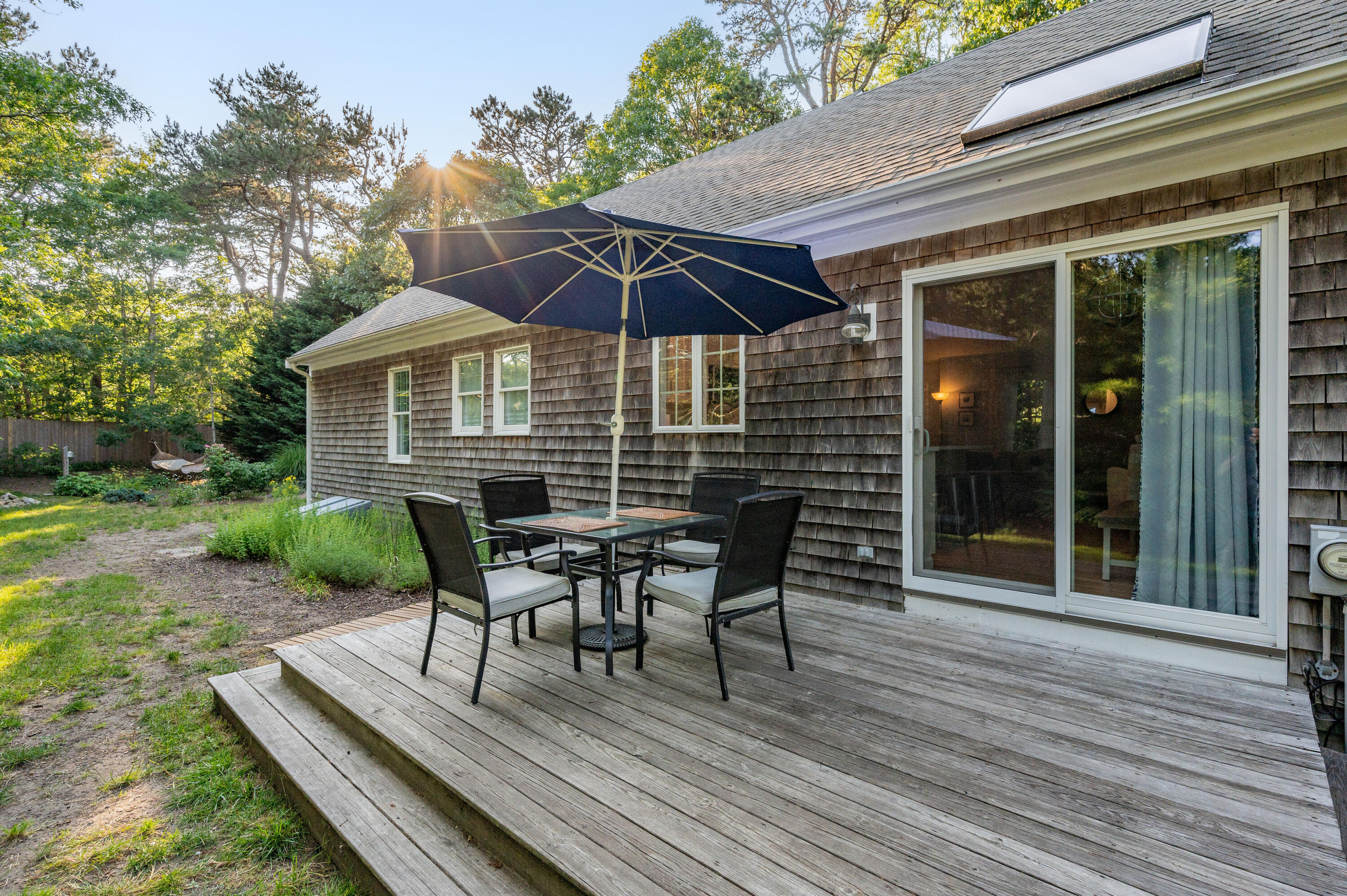 11 Quanset Road Orleans, MA 02653 - Photo 34 of 36 a view of a house with backyard porch and sitting area