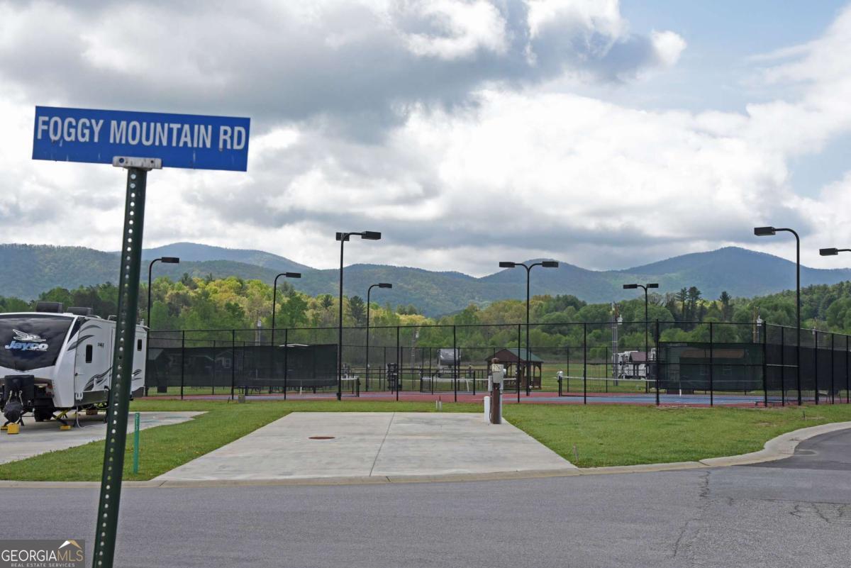 a view of a park with welcome board