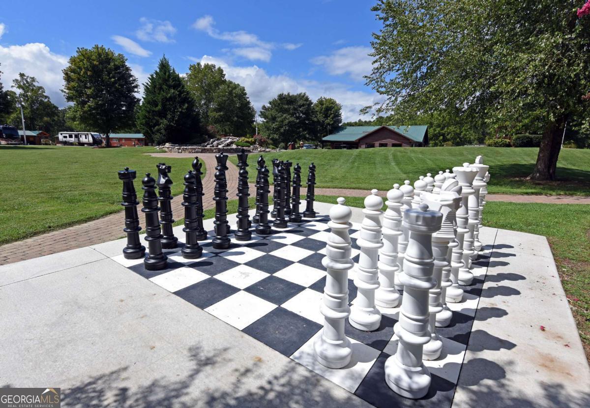278 Foggy Mountain Road Blairsville, GA 30512 - Photo 22 of 31 a view of a table and chairs in the yard