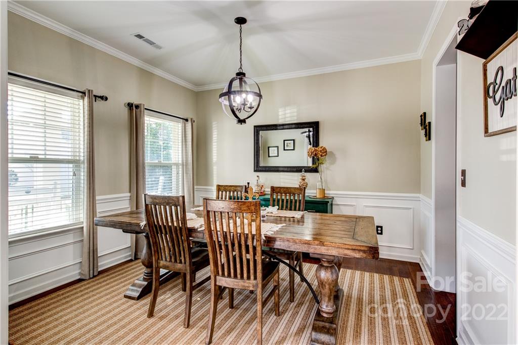 3022 Amaranth Drive Tega Cay, SC 29708 - Photo 5 of 33 a view of a dining room with furniture window and wooden floor