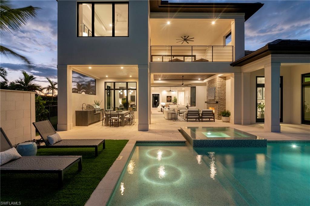6704 Newport Road Naples, FL 34109 - Photo 42 of 47 a view of a swimming pool with patio