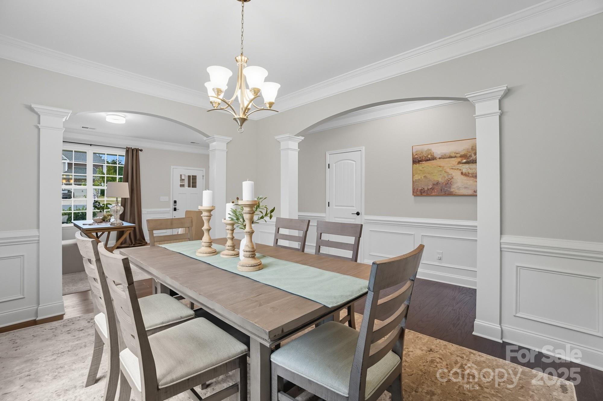 310 Annatto Way Fort Mill, SC 29708 - Photo 13 of 48 a view of a dining room with furniture and wooden floor