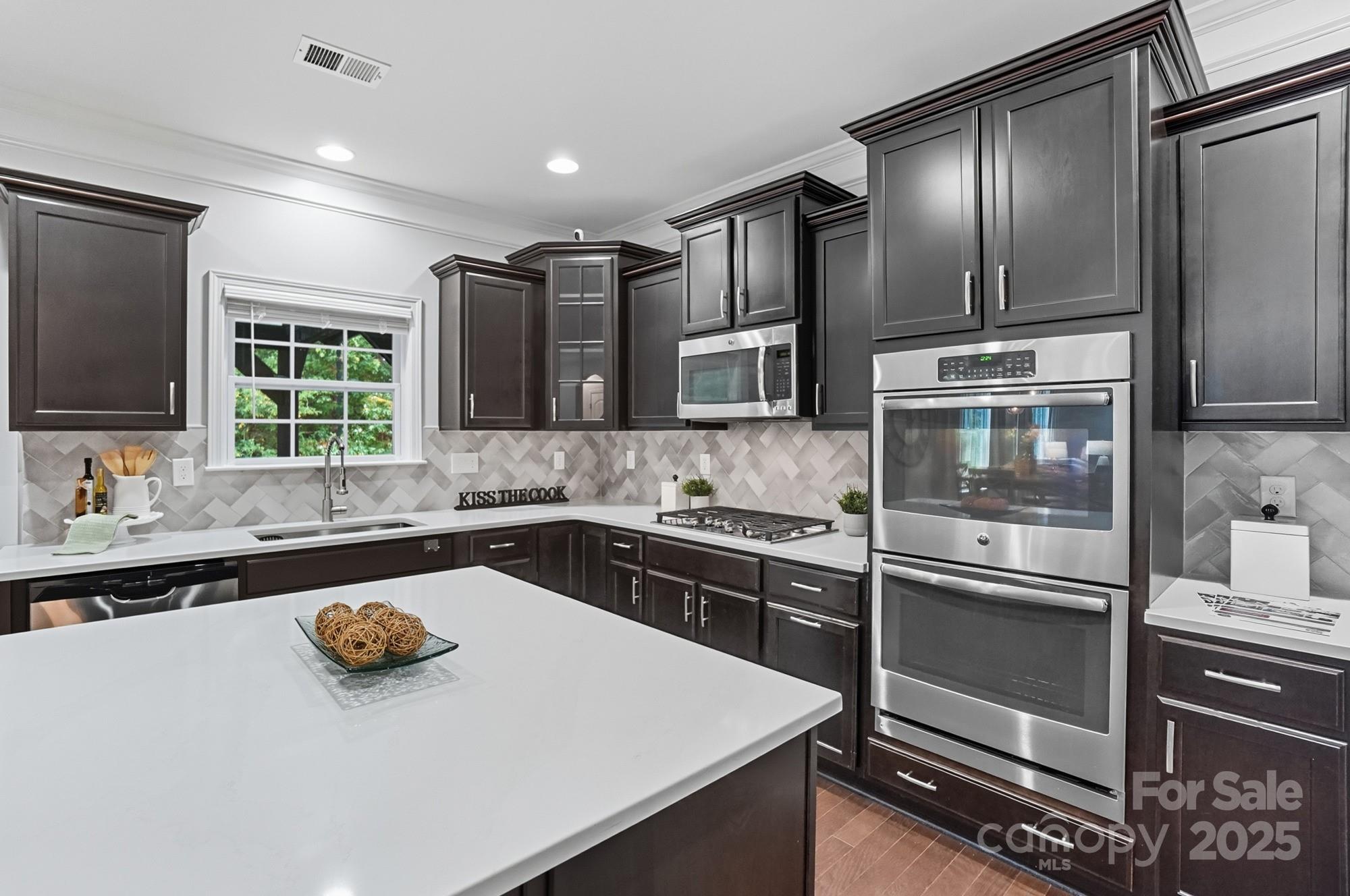 310 Annatto Way Fort Mill, SC 29708 - Photo 17 of 48 a kitchen with a refrigerator stove and sink