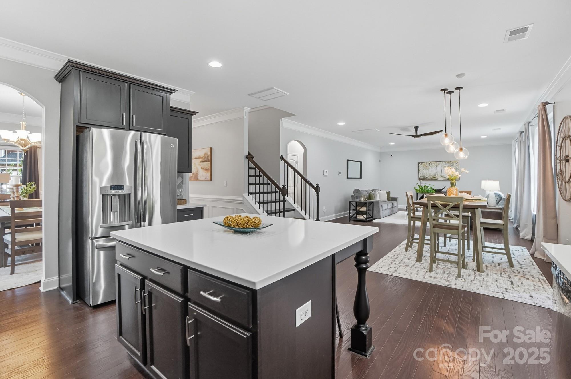 310 Annatto Way Fort Mill, SC 29708 - Photo 19 of 48 a kitchen with a table a refrigerator and chairs