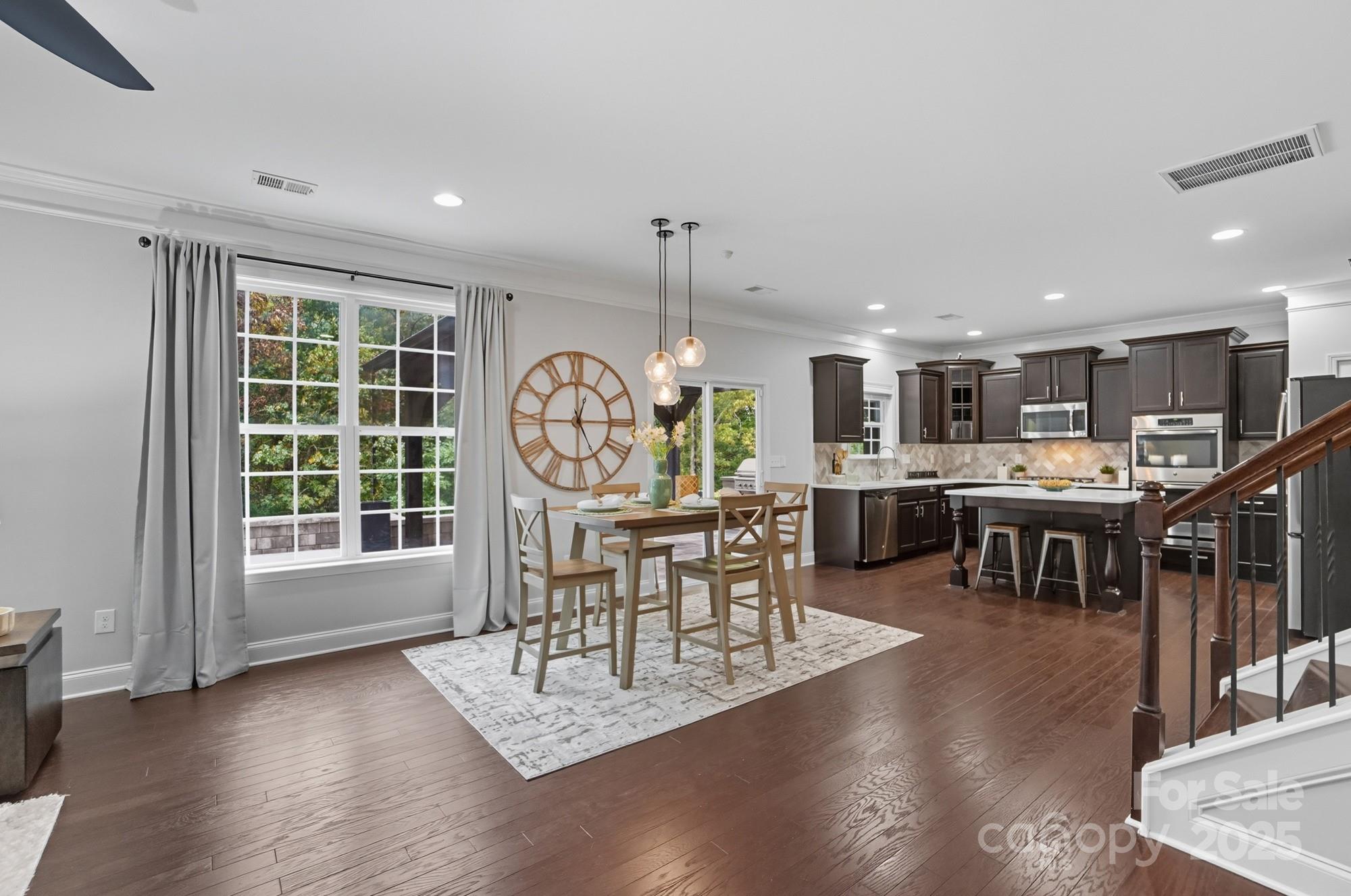 310 Annatto Way Fort Mill, SC 29708 - Photo 22 of 48 a view of a dining room with furniture window and wooden floor