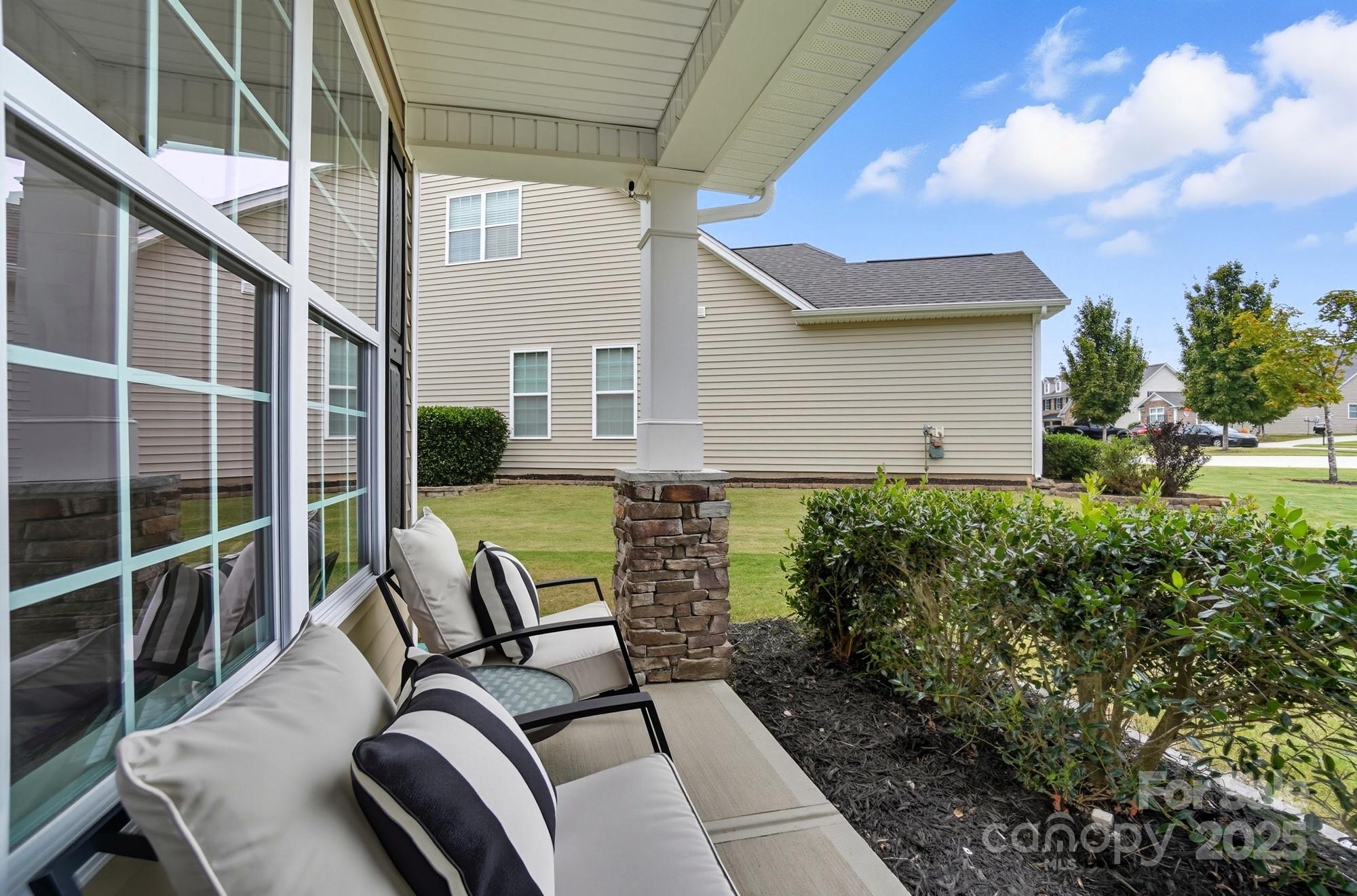 310 Annatto Way Fort Mill, SC 29708 - Photo 4 of 48 a view of a porch with furniture and a yard