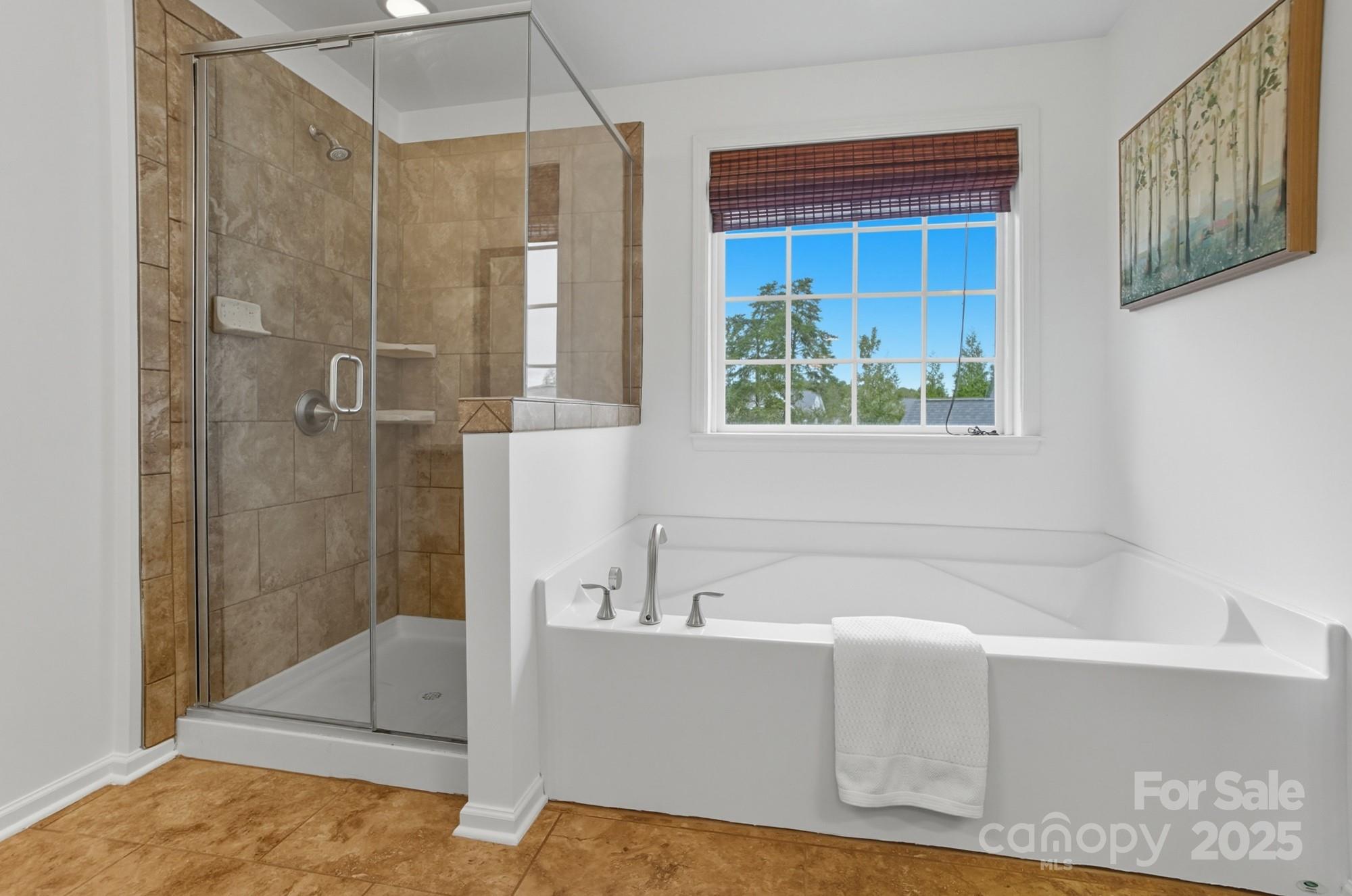 310 Annatto Way Fort Mill, SC 29708 - Photo 41 of 48 a bathroom with a bathtub and a shower