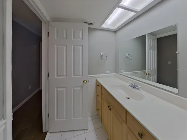 a bathroom with a sink and mirror