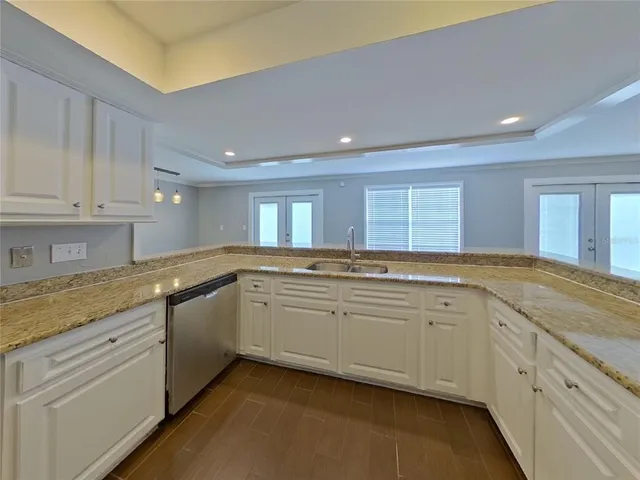 a large bathroom with a large window and double vanity