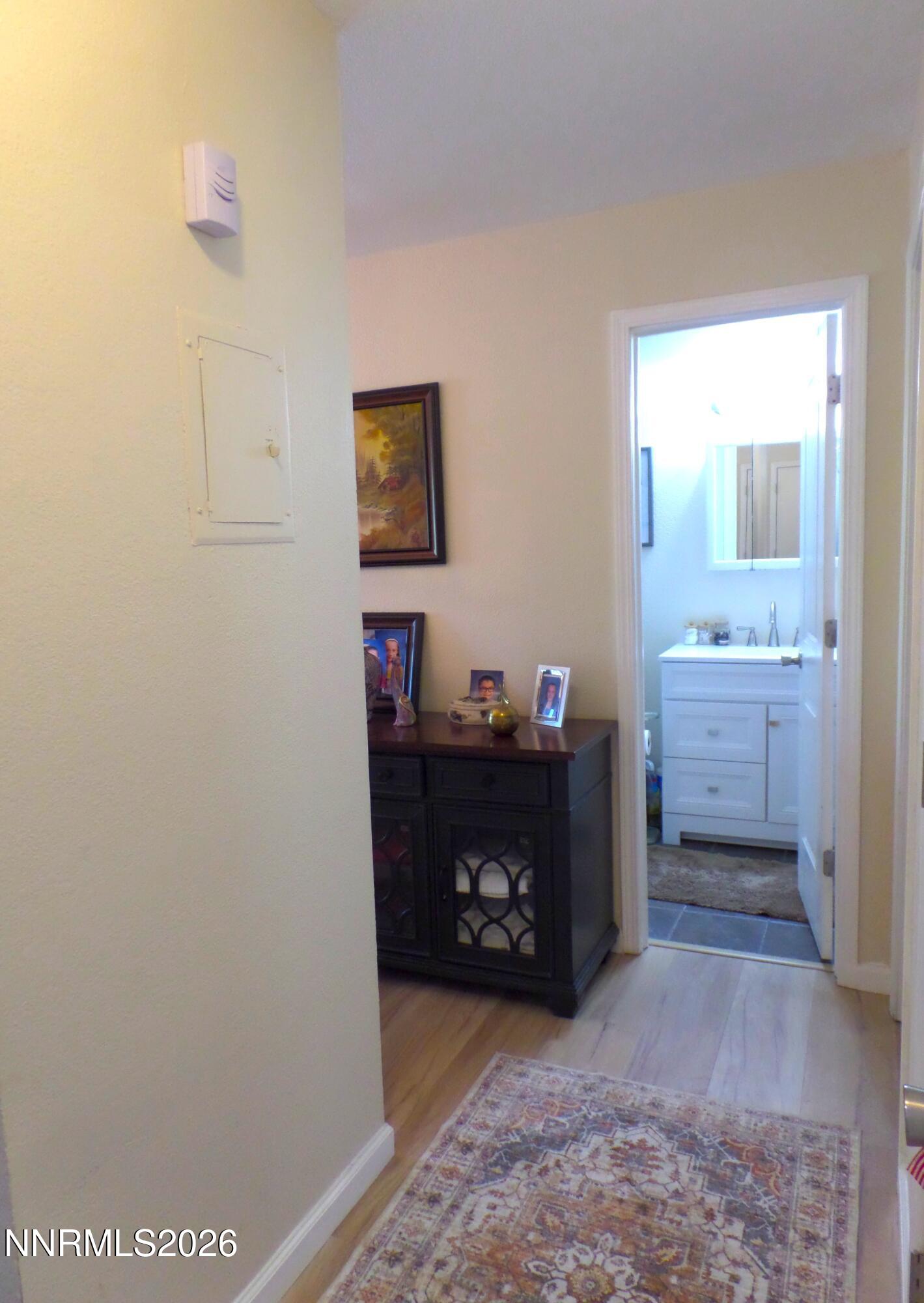 3890 East Leonesio Drive, Unit D1 Reno, NV 89512 - Photo 14 of 32 a room with a bed and a cabinets