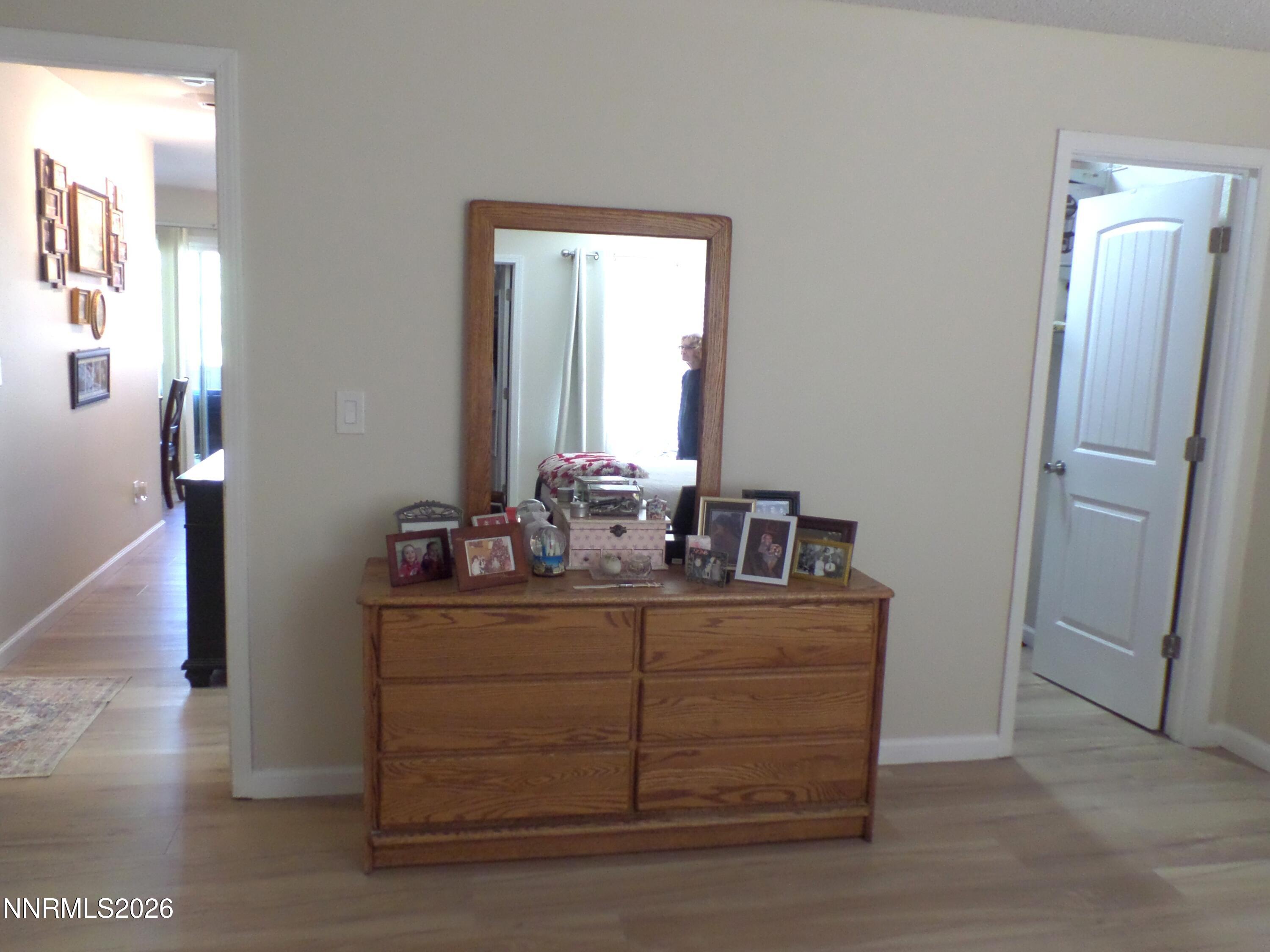 3890 East Leonesio Drive, Unit D1 Reno, NV 89512 - Photo 18 of 32 a room with a sink vanity and mirror