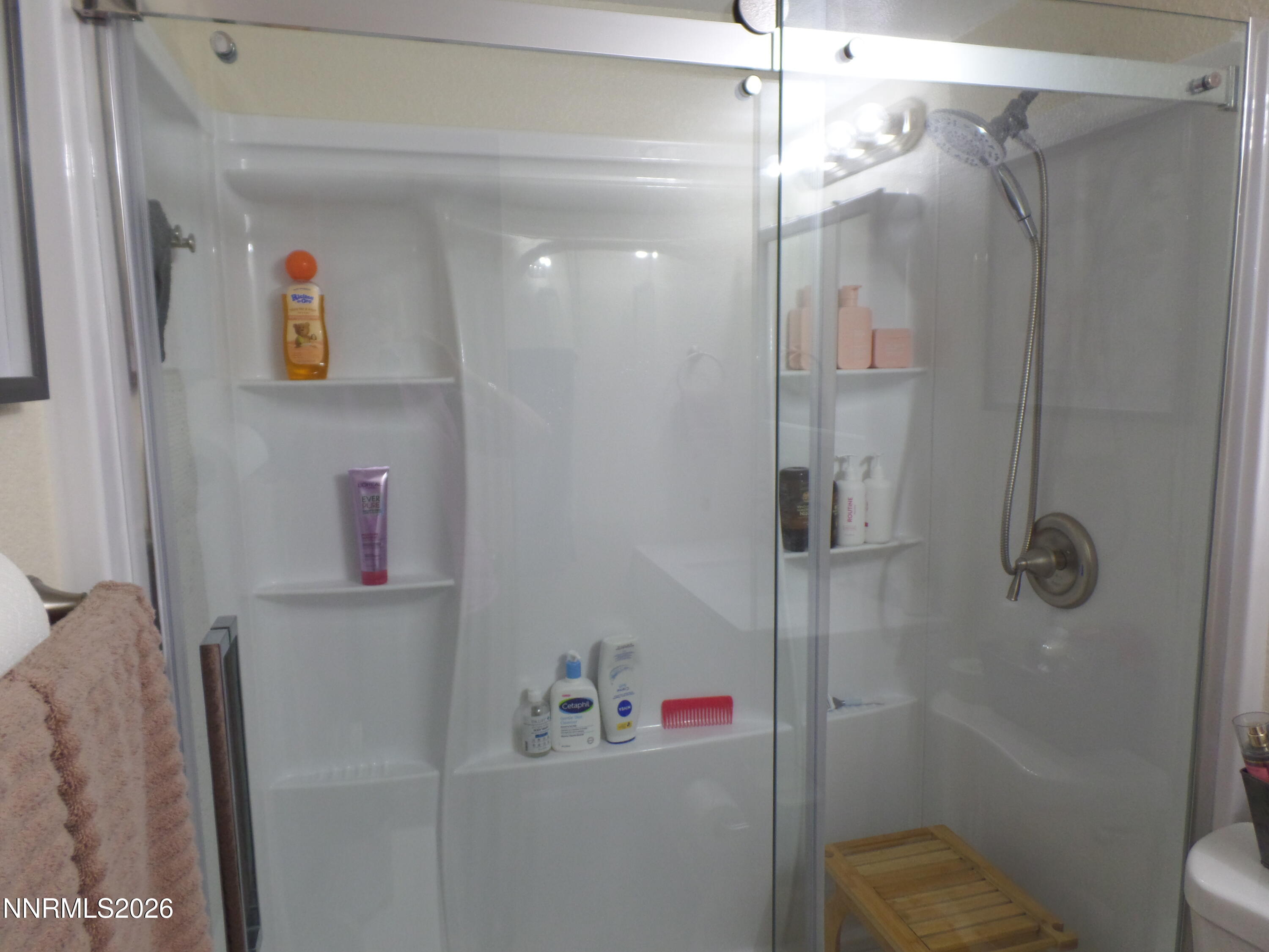 3890 East Leonesio Drive, Unit D1 Reno, NV 89512 - Photo 21 of 32 a bathroom with a shower and a sink