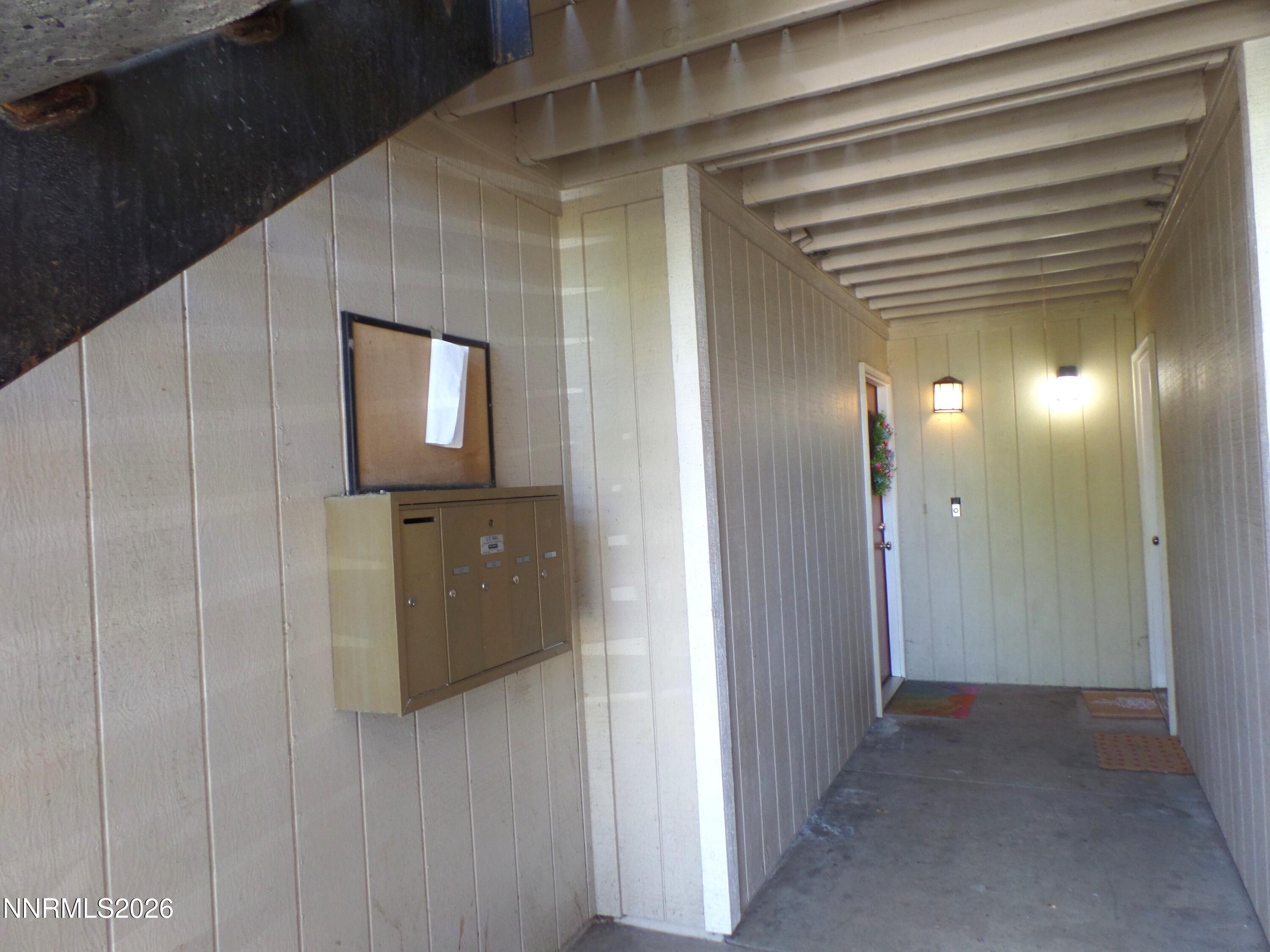 3890 East Leonesio Drive, Unit D1 Reno, NV 89512 - Photo 28 of 32 a view of a hallway with wooden floor