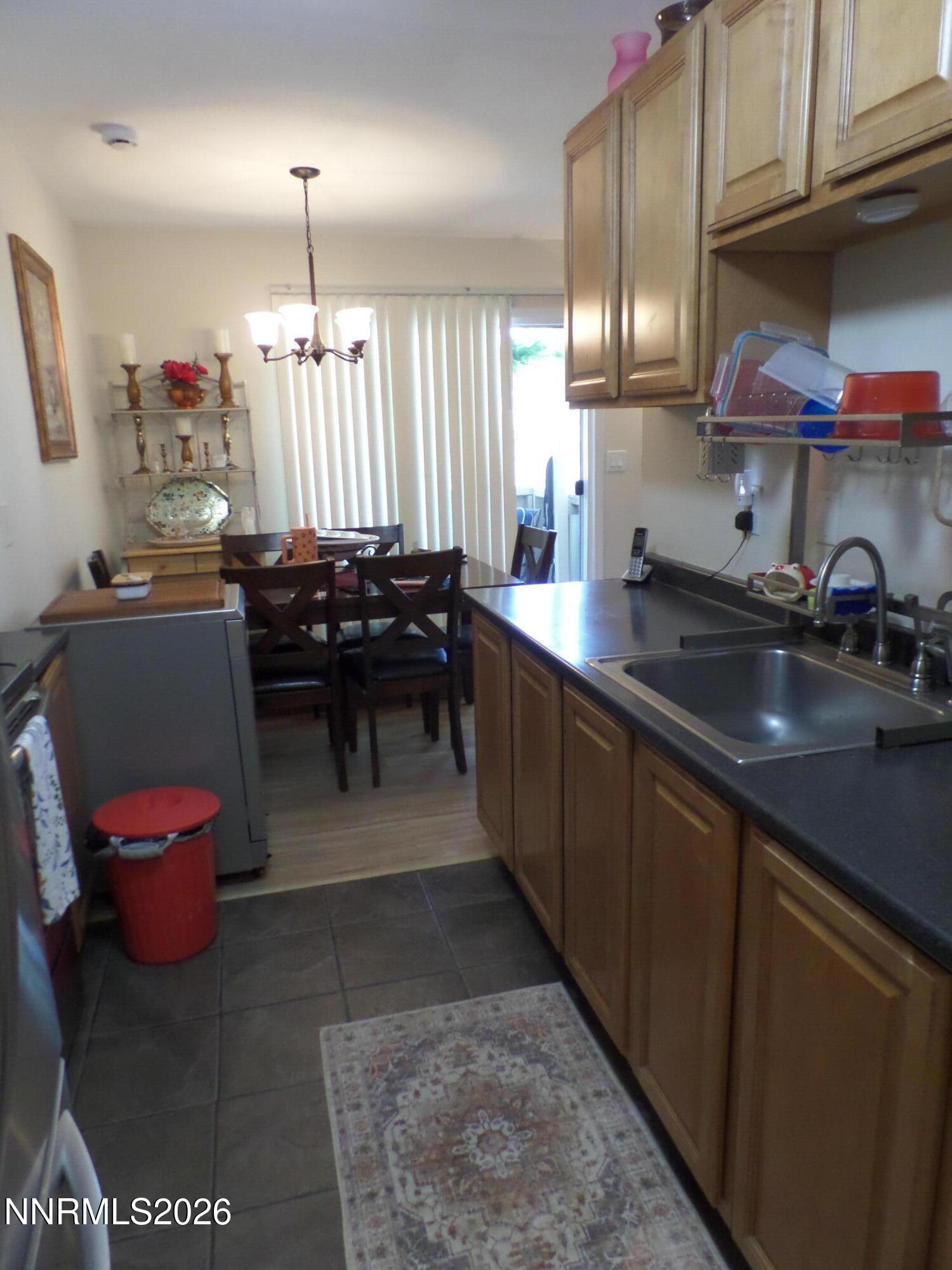 3890 East Leonesio Drive, Unit D1 Reno, NV 89512 - Photo 5 of 32 a kitchen with a sink and cabinets