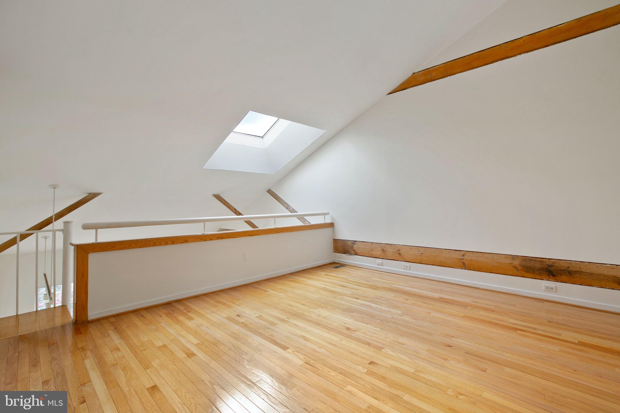 2639 Boston Street, Unit 313 Baltimore, MD 21224 - Photo 17 of 33 large top floor bedroom with a huge skylight