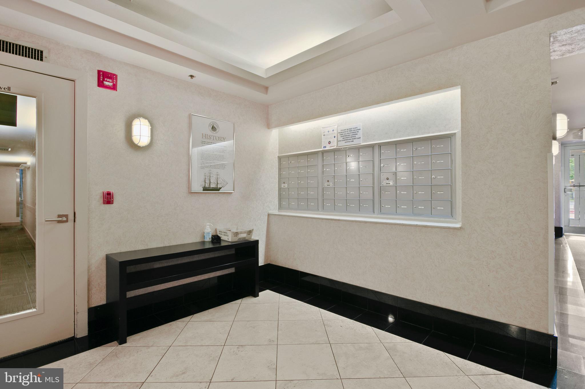 2639 Boston Street, Unit 313 Baltimore, MD 21224 - Photo 31 of 33 mailboxes and front door in lobby of building