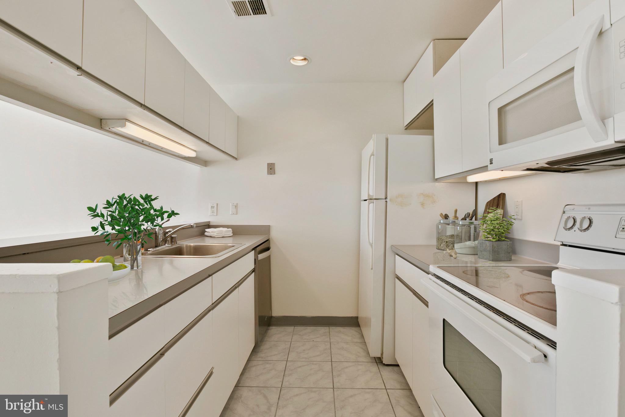 2639 Boston Street, Unit 313 Baltimore, MD 21224 - Photo 8 of 33 galley kitchen, virtually staged