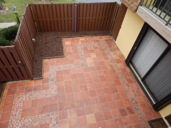 a terrace with outdoor seating and lake view