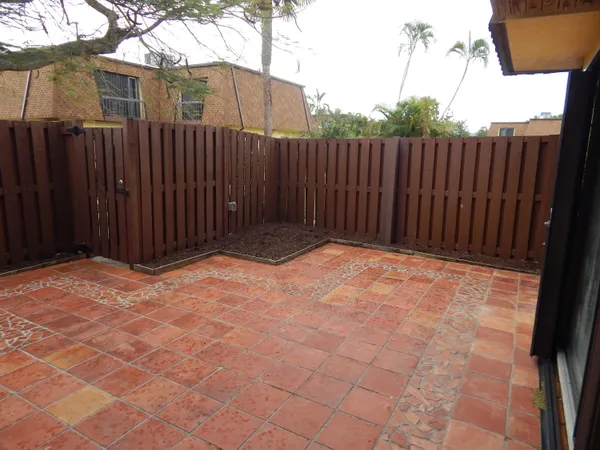 a view of small space with wooden fence