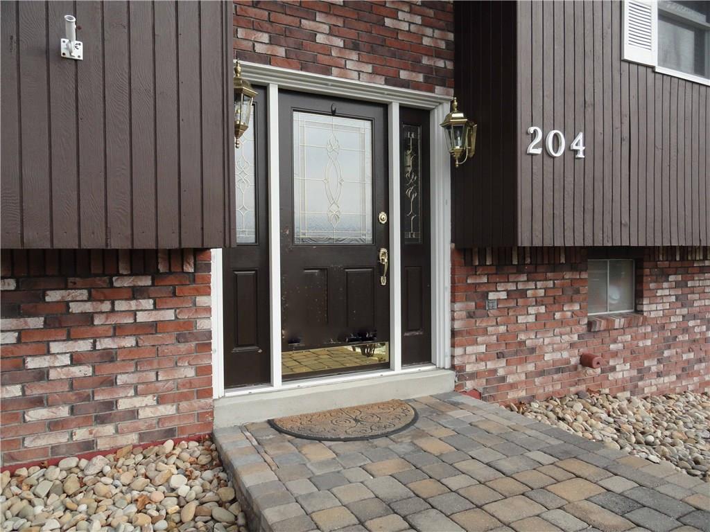 204 Sandy Hill Road Manor, PA 15642 - Photo 2 of 25 Sidewalk pavers from driveway to front door