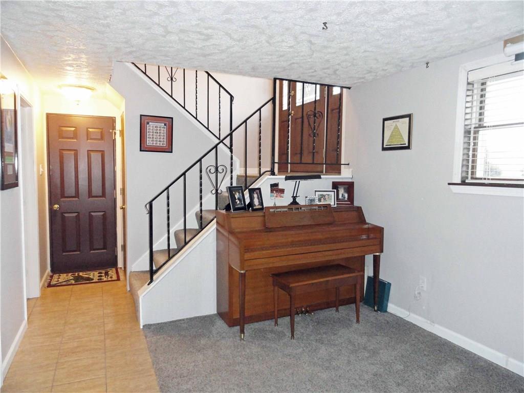 204 Sandy Hill Road Manor, PA 15642 - Photo 23 of 25 Entrance hall open to family room