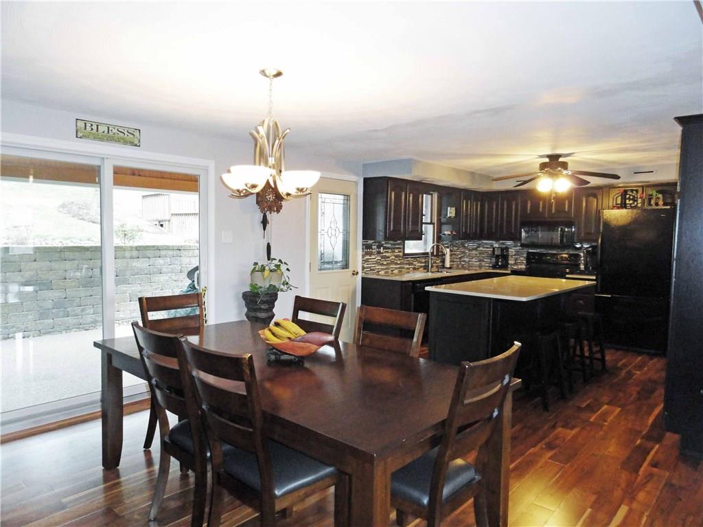 204 Sandy Hill Road Manor, PA 15642 - Photo 5 of 25 Open dining room & kitchen with new hardwood floor