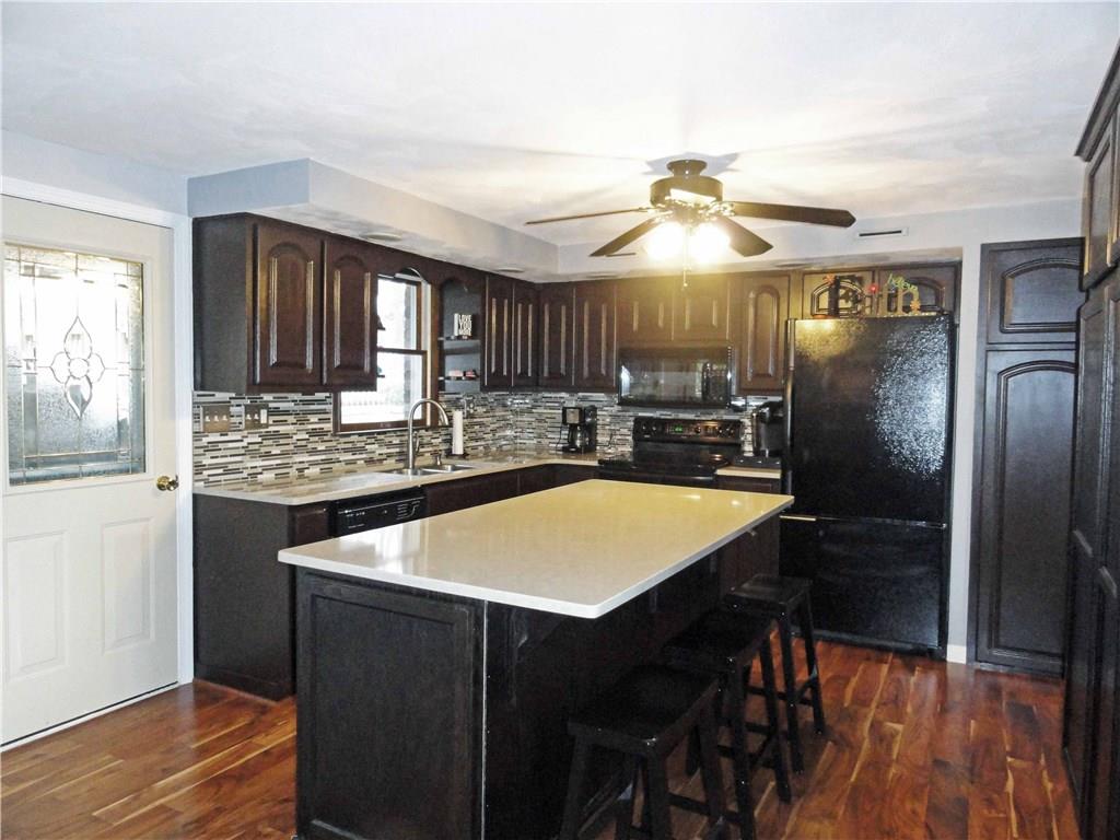 204 Sandy Hill Road Manor, PA 15642 - Photo 6 of 25 Nicely updated kitchen with new island and solid surface counter tops.