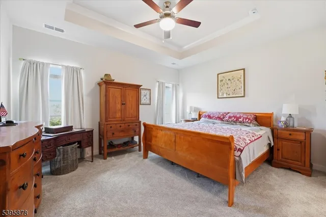 a bedroom with a large bed and a dresser