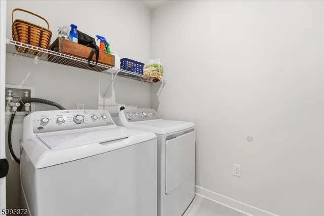 a view of a dining room with furniture and window