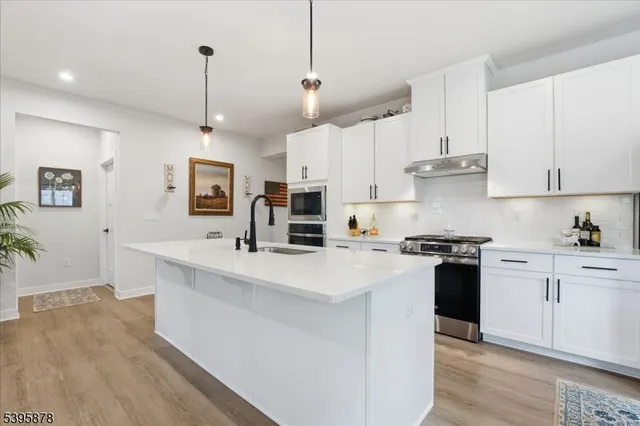 a view of a livingroom with tub and furniture