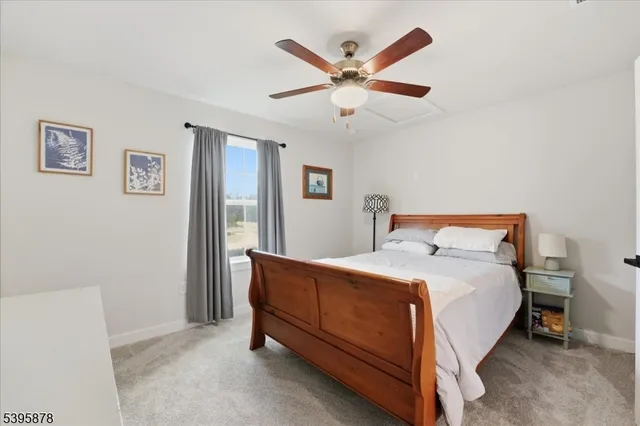 a porch with a table and chairs