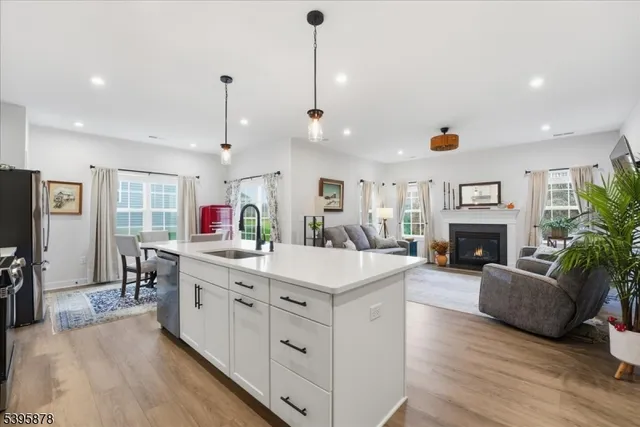 a view of living room with furniture and fireplace