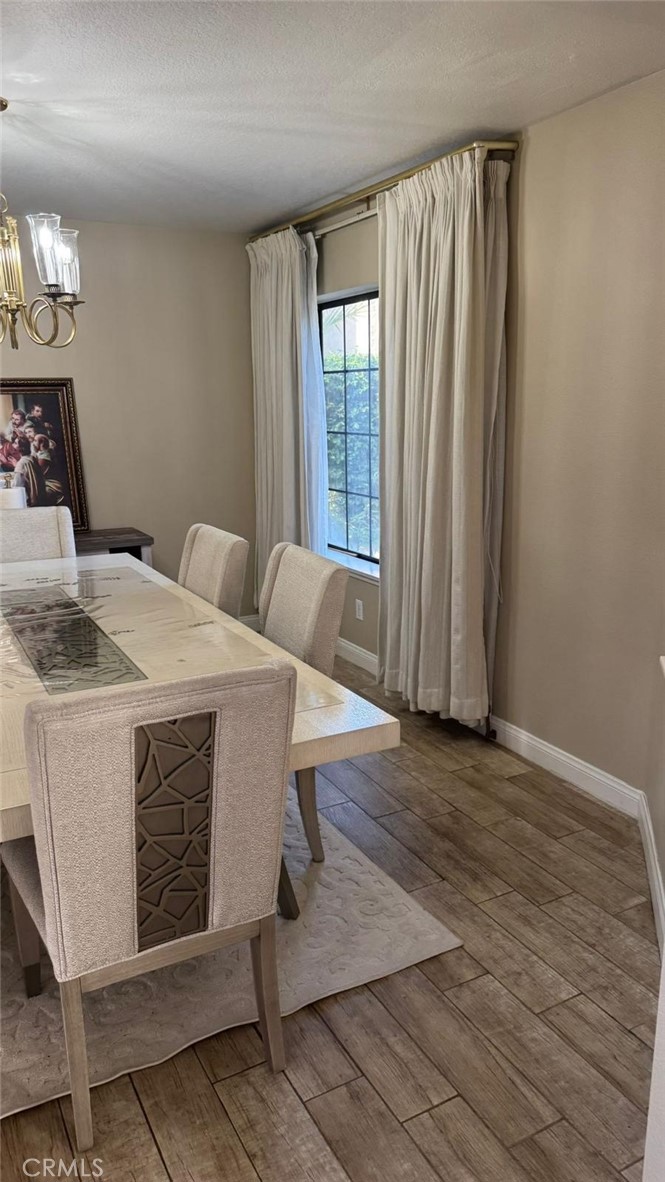 25 Morning Breeze, Unit 46 Irvine, CA 92603 - Photo 15 of 26 a living room with a bed furniture and a window