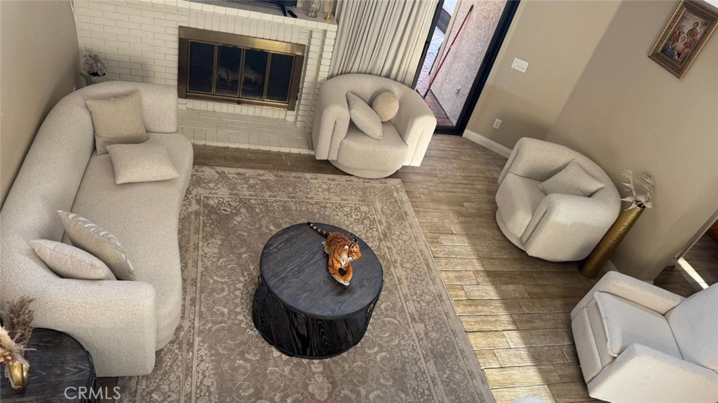 25 Morning Breeze, Unit 46 Irvine, CA 92603 - Photo 2 of 26 a living room with furniture and a fireplace