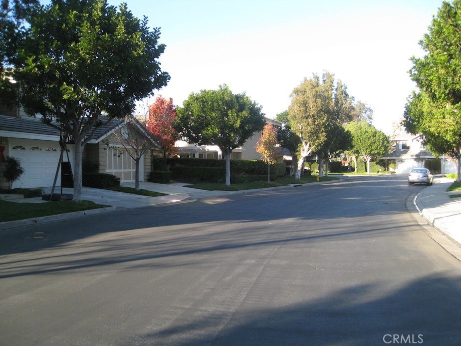 25 Morning Breeze, Unit 46 Irvine, CA 92603 - Photo 21 of 26 a house with a tree in the background