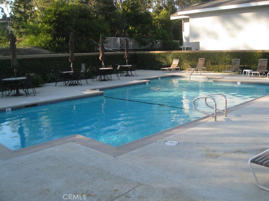25 Morning Breeze, Unit 46 Irvine, CA 92603 - Photo 25 of 26 a view of a swimming pool with a patio