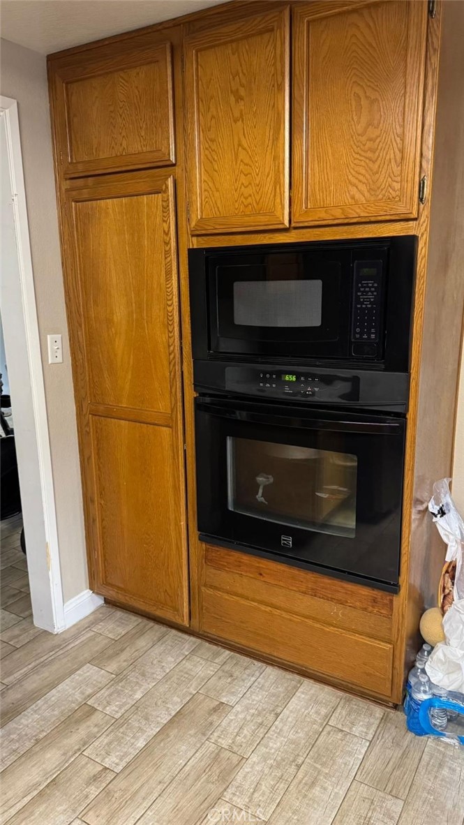 25 Morning Breeze, Unit 46 Irvine, CA 92603 - Photo 5 of 26 a kitchen with appliances and a microwave