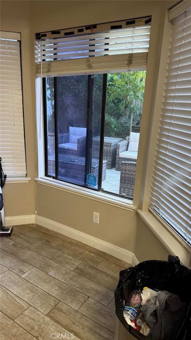 25 Morning Breeze, Unit 46 Irvine, CA 92603 - Photo 7 of 26 a view of a room with wooden floor and a window