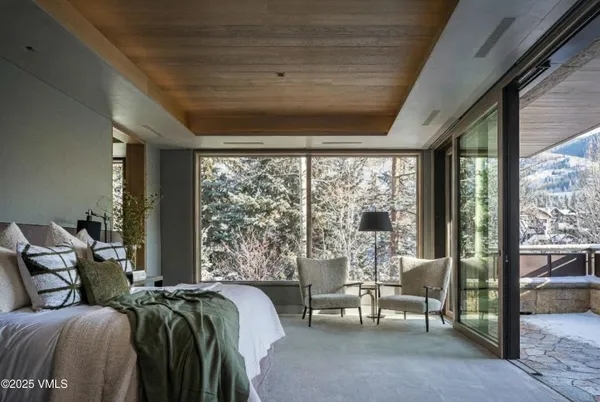a room with furniture and a large window
