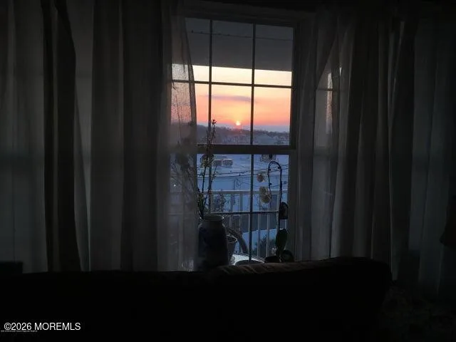 a view of empty room with windows