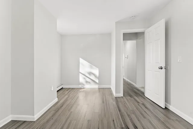 a view of wooden floor in an empty room